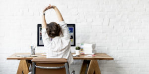 Woman Yoga Stretching at Work